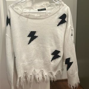 White lightning bolt sweater
